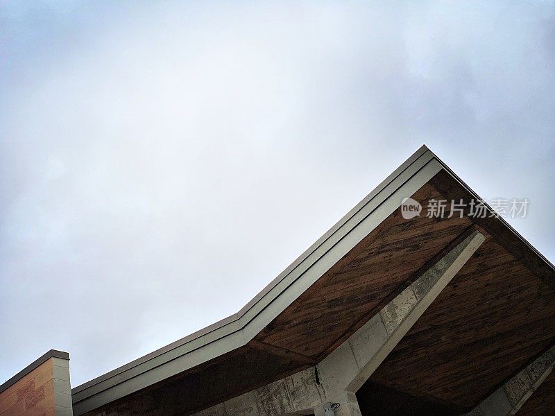 Angular Porch Roof Piercing the Sky